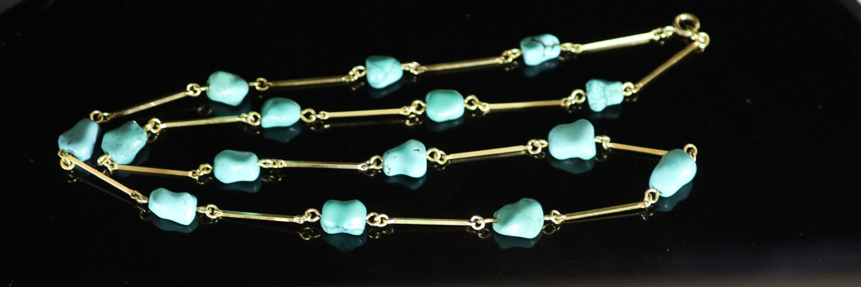 An early to mid 20th century Liberty & Co style gold baton link and turquoise pebble set necklace